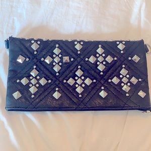 Black studded clutch bag